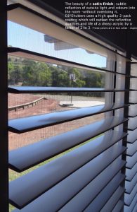 White plantation shutters with a satin finish allowing light to filter through a window.