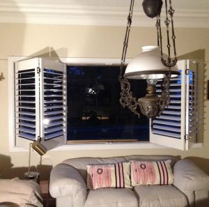 Bifold plantation shutters an a partially open position (NewtonDIY8)