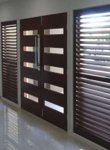 Modern Wooden Doors and Shutters 1 Contemporary wooden doors with horizontal slats and matching window shutters in a bright interior.
