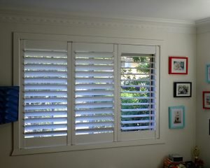 Pivot Hinge urethane painted Shutter Panels reflect the blue of the sky