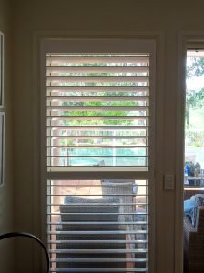 Semigloss shutter paint reflects the colour of the tiles and blue sky