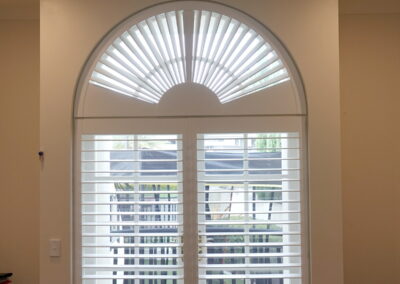 Fan style Shutter blind in an arched window