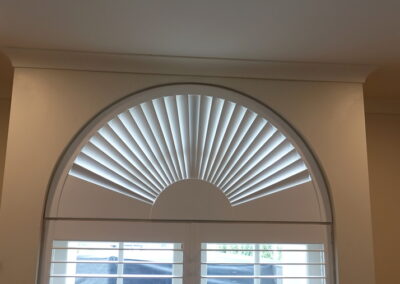 Fan style Shutter blind in an arched window