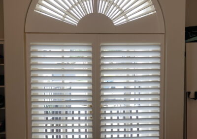 Fan style Shutter blind in an arched window